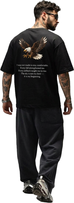 Man wearing a black t-shirt with an eagle design and text on the back.